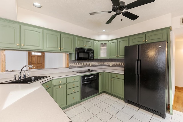 kitchen with sink, backsplash, light tile patterned flooring, ceiling fan, and black appliances