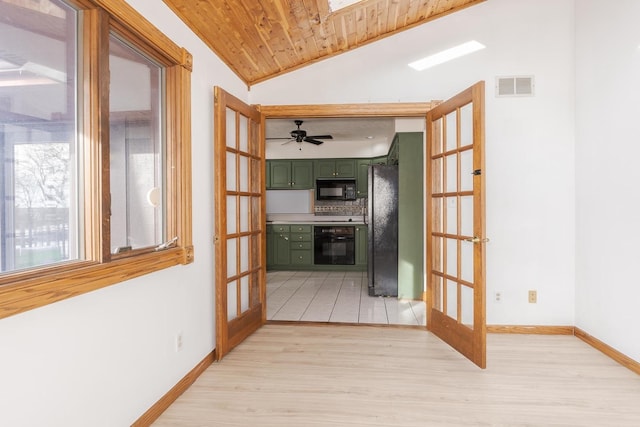 corridor with light wood-type flooring, wood ceiling, french doors, and lofted ceiling