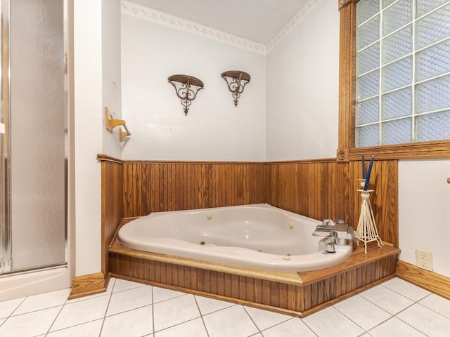 bathroom featuring tile patterned flooring and a bathtub