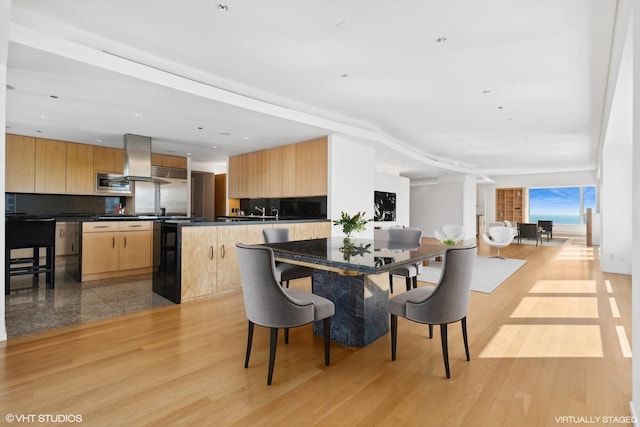 dining space featuring light wood-type flooring