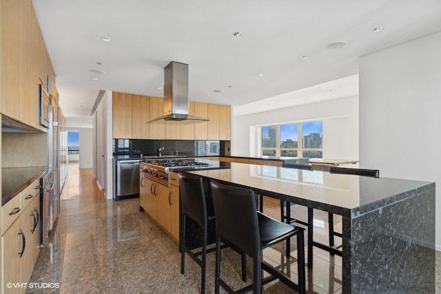 kitchen with a kitchen island, tasteful backsplash, island exhaust hood, stainless steel appliances, and light brown cabinets