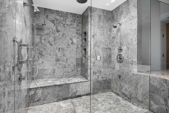 bathroom featuring a tile shower