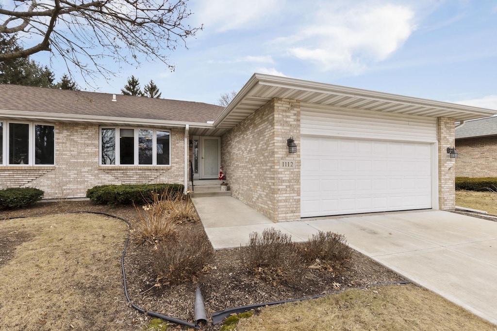 single story home with a garage