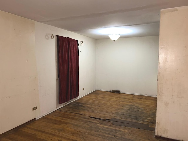 empty room featuring dark hardwood / wood-style floors