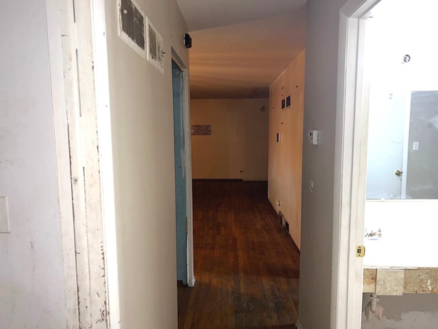 corridor featuring dark wood-type flooring