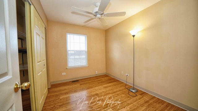 unfurnished room featuring light hardwood / wood-style flooring and ceiling fan