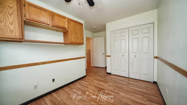 unfurnished bedroom featuring a closet, ceiling fan, and light wood-type flooring