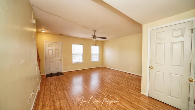 unfurnished room with ceiling fan and light hardwood / wood-style flooring