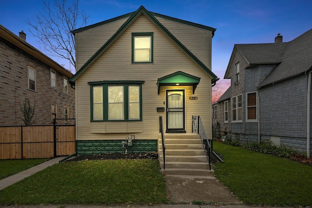 view of front of property with a lawn