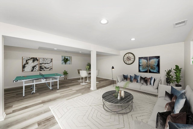 living room with billiards and light wood-type flooring