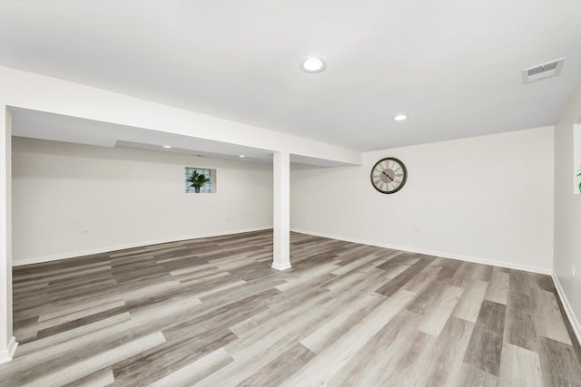 basement featuring light hardwood / wood-style flooring