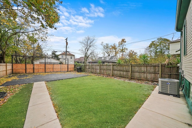 view of yard with central AC