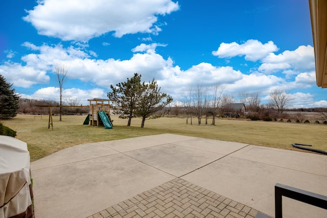 view of patio / terrace with a grill and a playground