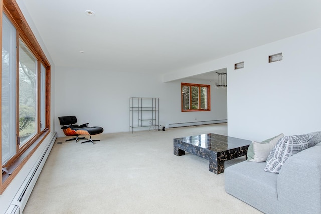 carpeted living room featuring a baseboard radiator