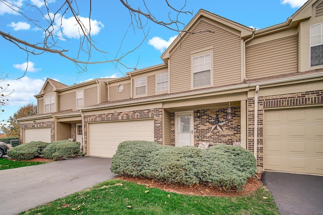 multi unit property featuring a garage