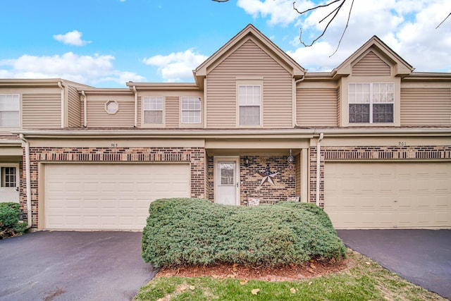 multi unit property featuring a garage