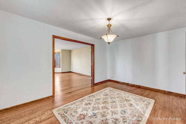 spare room featuring hardwood / wood-style flooring