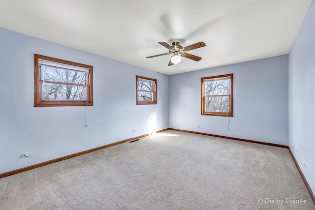 carpeted empty room with ceiling fan