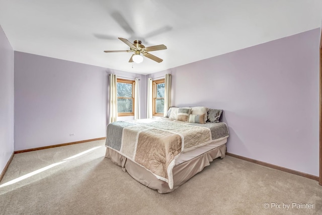 bedroom featuring ceiling fan and light colored carpet