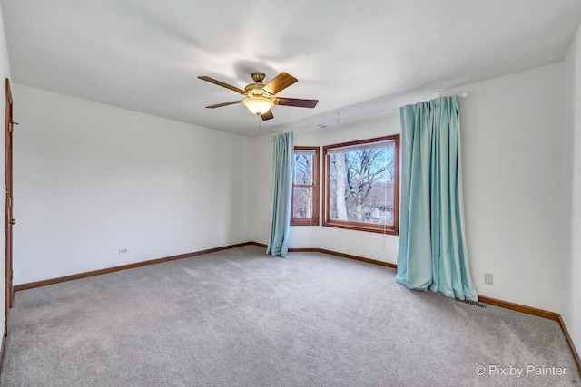 carpeted empty room with ceiling fan