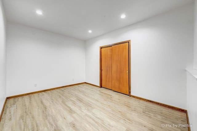 unfurnished room featuring light hardwood / wood-style flooring