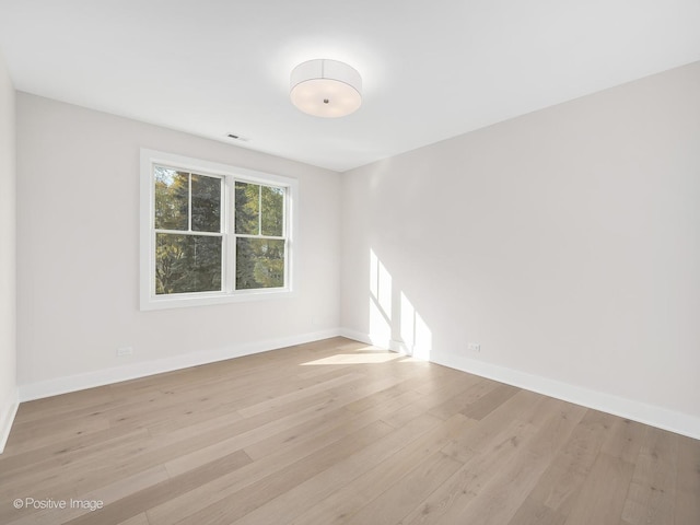 unfurnished room featuring light hardwood / wood-style flooring