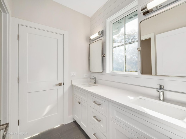 bathroom with tile patterned flooring and vanity