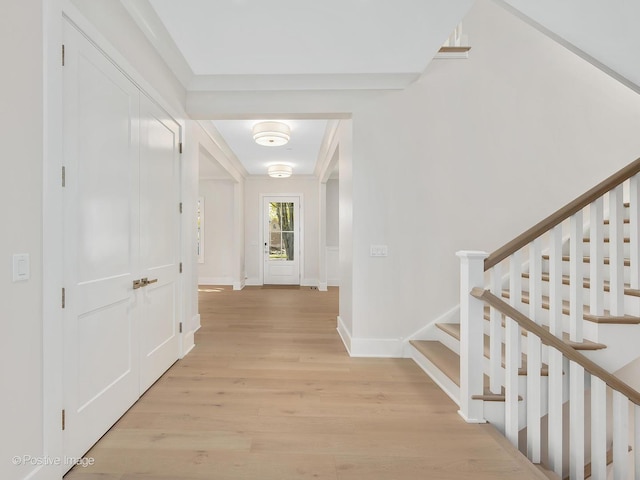 hall with light hardwood / wood-style floors