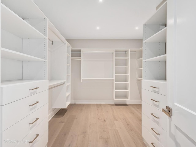 spacious closet with light hardwood / wood-style floors