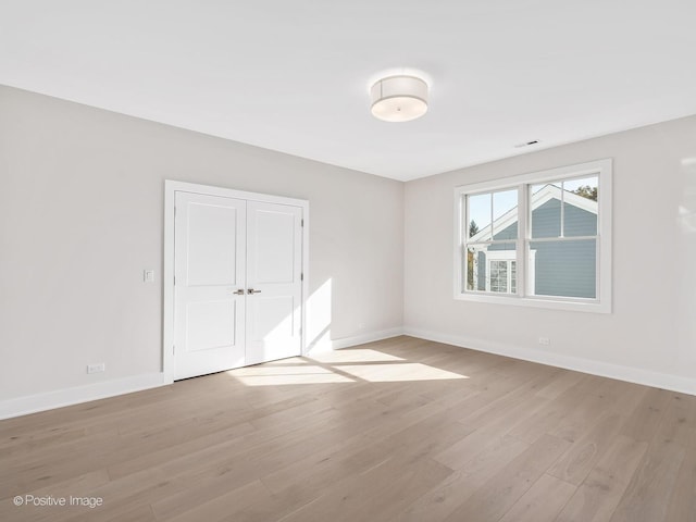 spare room with light wood-type flooring