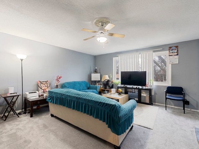 bedroom featuring ceiling fan, carpet, and a textured ceiling