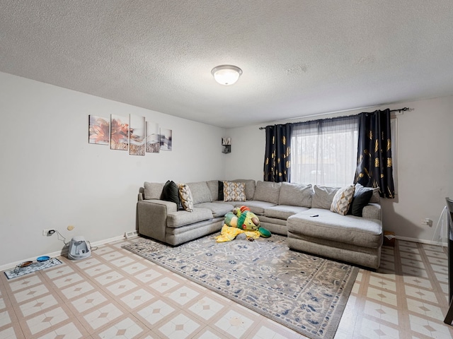 living room featuring a textured ceiling