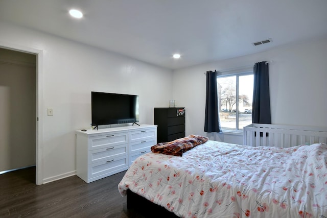 bedroom featuring dark wood-type flooring