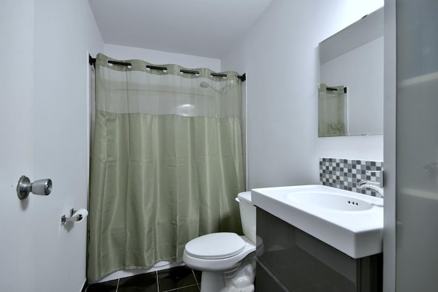 bathroom featuring tile patterned flooring, backsplash, vanity, curtained shower, and toilet