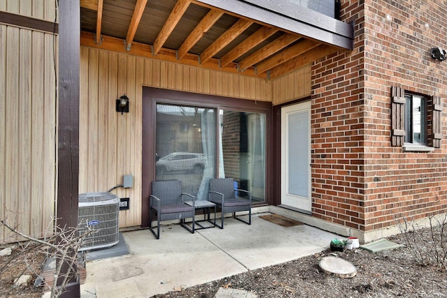 entrance to property featuring central AC and a patio area