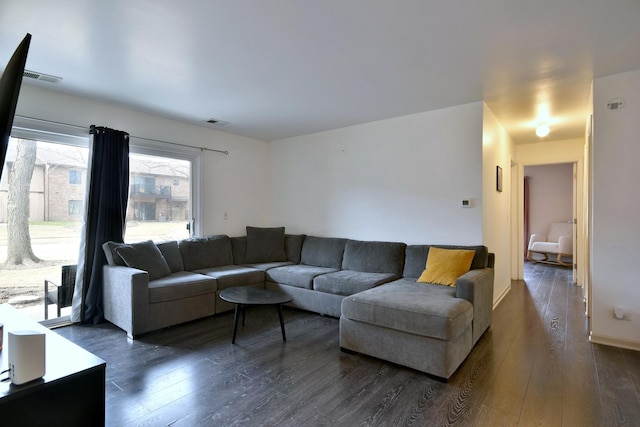 living room featuring dark wood-type flooring