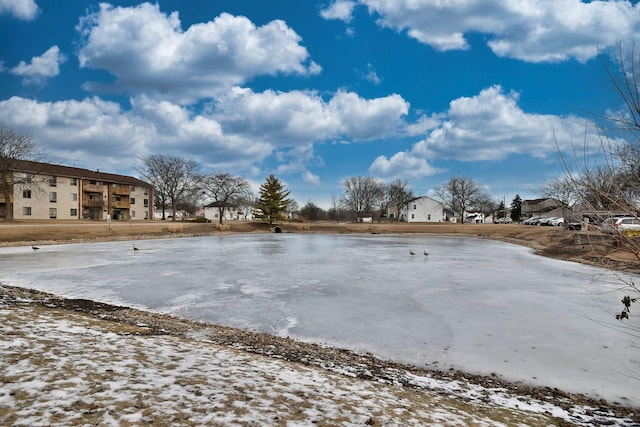 snowy yard with a water view