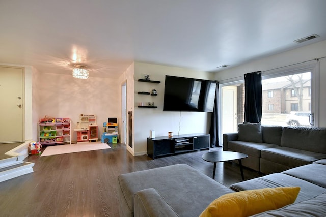 living room with dark hardwood / wood-style floors