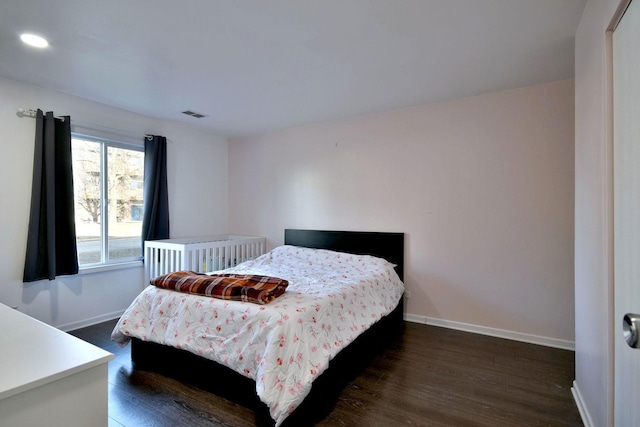 bedroom featuring dark wood-type flooring