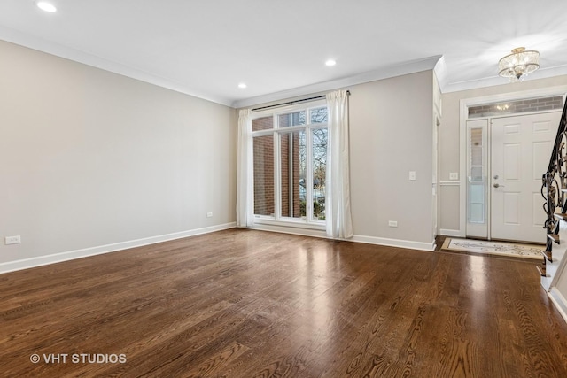 foyer with recessed lighting, crown molding, baseboards, and wood finished floors