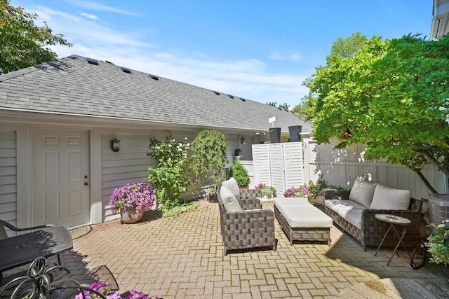 view of patio / terrace with an outdoor hangout area and fence