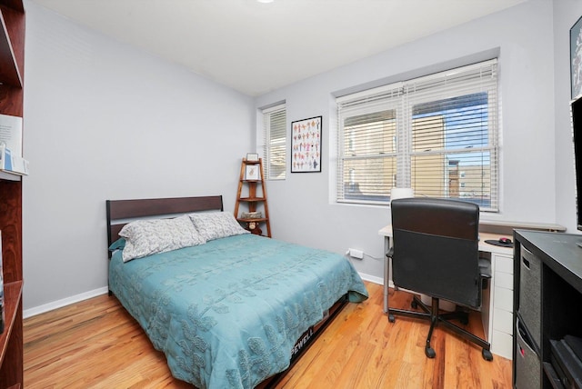 bedroom with light wood-type flooring