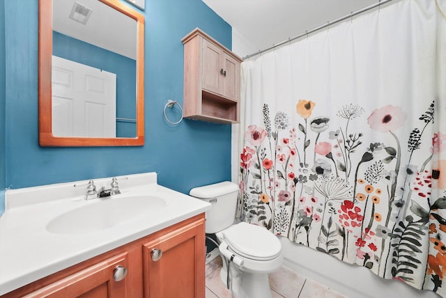 full bathroom with tile patterned flooring, vanity, shower / tub combo, and toilet