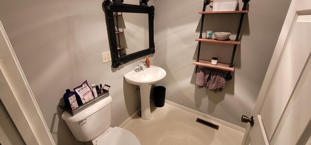 bathroom featuring toilet