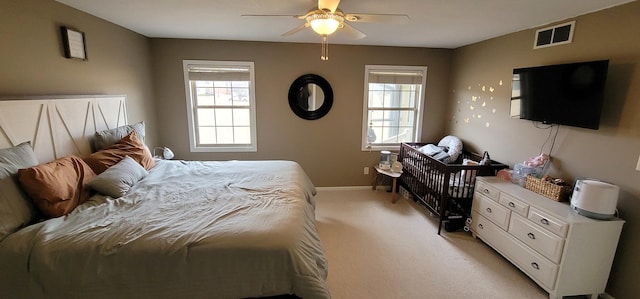 carpeted bedroom featuring ceiling fan