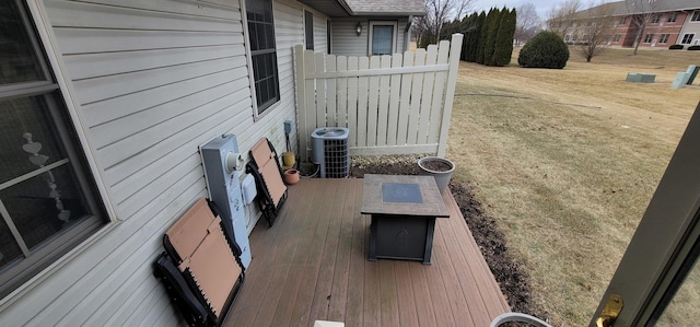 exterior space featuring cooling unit and a yard