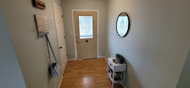 doorway with light wood-type flooring