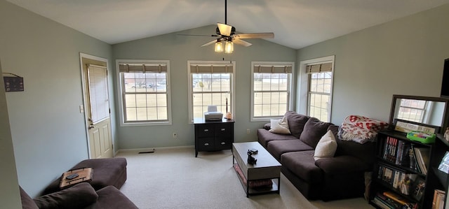 carpeted living room featuring lofted ceiling, plenty of natural light, and ceiling fan