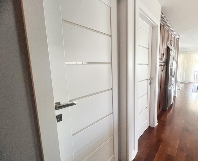 hallway with dark hardwood / wood-style floors