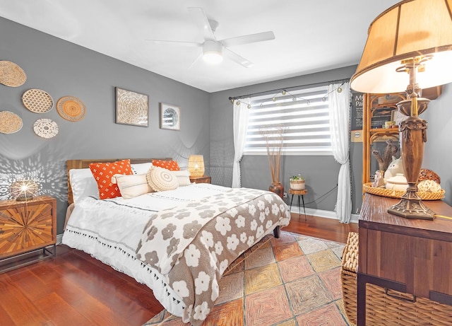 bedroom featuring hardwood / wood-style flooring and ceiling fan